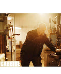 Man operating a CNC machine in workshop, demonstrating use of Pro Grade One Eighth Inch Shank Carbide End Mills Three Point One Seven Five By Seventeen Millimeter Up And Down Cut Square Nose CNC Spiral Router Bits Two Flute For Wood Five Piece Precision Set ALTIN Coated For Longer Tool Life And Smoother Cuts.