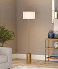64 Inch Tall Floor Lamp With Brass Finish And White Linen Drum Shade Dope Modern Home Lighting For Living Room Or Bedroom Compatible With Incandescent LED CFL Bulbs in a living room setting.
