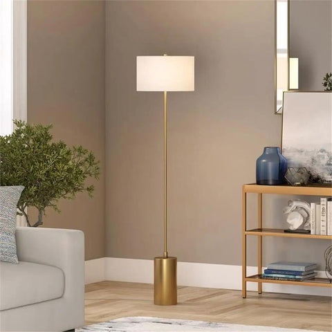 64 Inch Tall Floor Lamp With Brass Finish And White Linen Drum Shade Dope Modern Home Lighting For Living Room Or Bedroom Compatible With Incandescent LED CFL Bulbs in a living room setting.