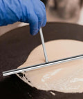 Must Have Pro Grade Crepe Spreader And Spatula Kit Set 7 Inch T Shaped Batter Spreader in use on crepe pan