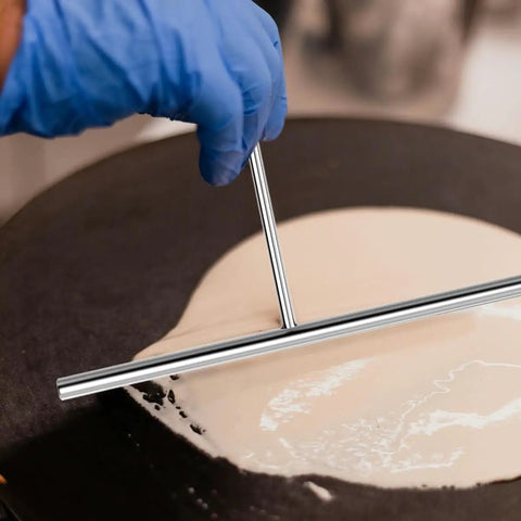 Must Have Pro Grade Crepe Spreader And Spatula Kit Set 7 Inch T Shaped Batter Spreader in use on crepe pan