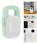 Close-up of Sturdy ABS Kitchen Cabinet Locks 4 Pack Kid Safe Childproof Latches for Oven and Stove on white and green appliance