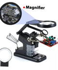 Rechargeable USB Welding Clip Light With Magnifier for soldering and repair on the workbench, showing magnifier lens detail