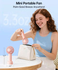 Mini Portable USB Rechargeable Handheld Fan, 3 Speeds, Cute Pink Travel Companion demonstrated by a woman with a purse