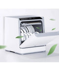 No Hookup Countertop Dishwasher That Sets Up In Minutes And Cranks Out Immaculate Loads Daily While Serving Up Sparkling Results With Fast High Temperature Wash And Dry Cycle with open door and clean dishes inside.