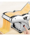 Automatic Electric Noodle And Pasta Maker making fresh pasta, stainless steel finish, interchangeable blades in use.