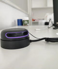 RPLIDAR A2M12 360 Degree Lidar Scanner for Robotic Mapping and Navigation on a desk, black with purple accents, wired