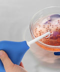 220ML Rubber Squeeze Bulb For Liquid Handling, Heavy-Duty Manual Pipette Sucker, Blue bulb in action with fluid in petri dish