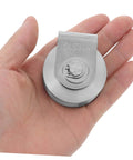 Hand holding heavy duty sliding gate guide roller and stainless steel pulley for track doors, pro grade industrial hardware.