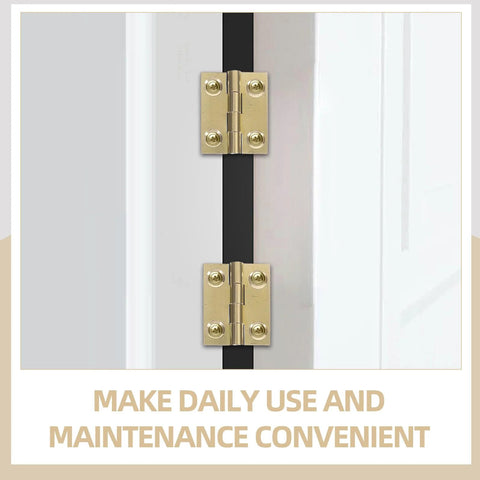 Front view of two brass folding cabinet door hinges with screws on white door