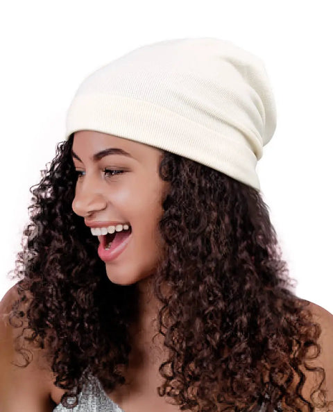 Woman smiling wearing Cozy Satin Lined Slouchy Beanie For Women Sleep Cap Night Hair Care Hat Rib Knit Winter Warmth Keeps Curls Frizz Free