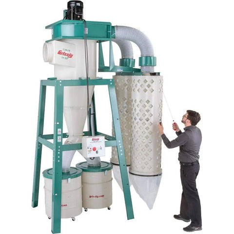 Heavy Duty 10 Horsepower 3 Phase Cyclone Dust Collector With 4029 CFM Suction and Dual Collection Drums, shown in use.