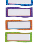 Magnetic Name Plates For Desks And Classrooms Reusable Dry Erase Name Tags Set Of 20 In Four Colors, shown in blue, purple, orange, and green.