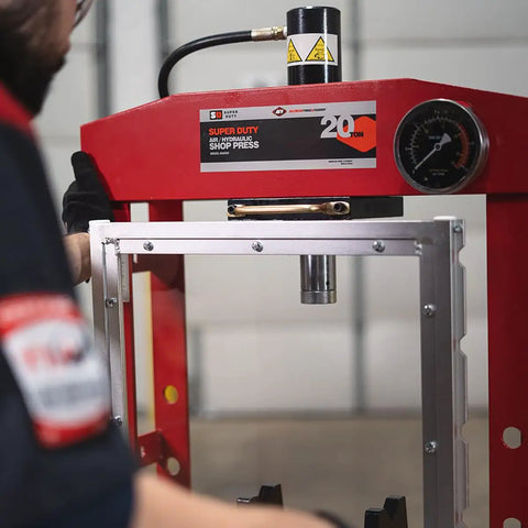 20 Ton Hydraulic Shop Press with Dual Air Motor and 7 Position Bed Height, shown in red frame with polycarbonate shield