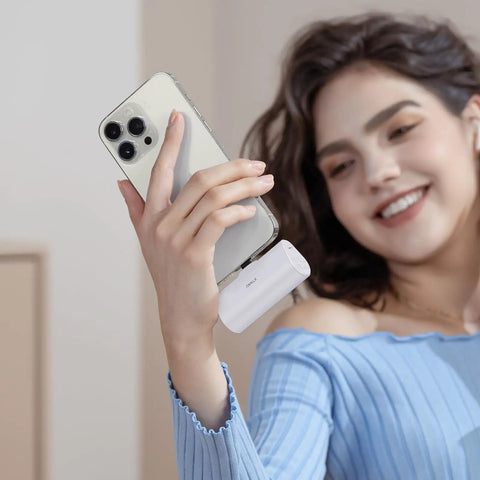 Pocket Sized 4500 Mah Portable Power Bank With 20W Fast Charge And Dual Usb C Ports For iPhone 17 16 15 Plus Pro Max And Samsung Galaxy S25 S24 S23 Android Travel Battery Pack held by a woman.