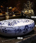 Heavy Duty Morning Glory Oval Bathroom Sink Crafted From Glossy Ceramic Featuring No Splash Countertop Mount And Sloped Drainage For Easy Cleanup And Total Powder Room Vibes, showing dimensions 60cm x 40cm x 15cm.