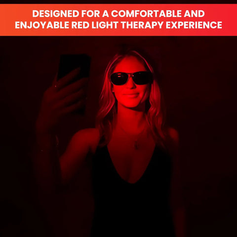 Woman wearing Game Changing Red Light Therapy Glasses Block 600Nm To 900Nm Rays, smiling in red light.