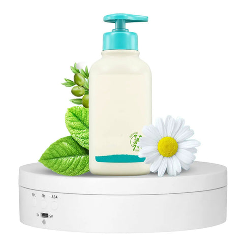 Motorized Electric Turntable Display Stand With Silent 360 Degree Rotation For Jewelry And Watches Shop Exhibition with a bottle and flowers