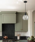 Farmhouse Black Globe Pendant Light With Hand Blown Seeded Glass And Easy Access Open Bottom 8 Inch Globe Adjustable Height in kitchen