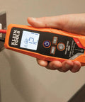 ET250 Voltage Meter And AC/DC Tester Digital Multimeter For Low Voltage Work With Auto On When Measuring, Backlit LCD Display, Built In Test Lead Holders And Battery Included in use, showing AC measurement on screen.