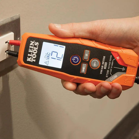ET250 Voltage Meter And AC/DC Tester Digital Multimeter For Low Voltage Work With Auto On When Measuring, Backlit LCD Display, Built In Test Lead Holders And Battery Included in use, showing AC measurement on screen.