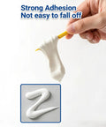 Hand holding wall repair paste showing texture and adhesion, part of Wall Repair Paste Kit For Drywall Cracks And Nail Holes, 8.8oz.