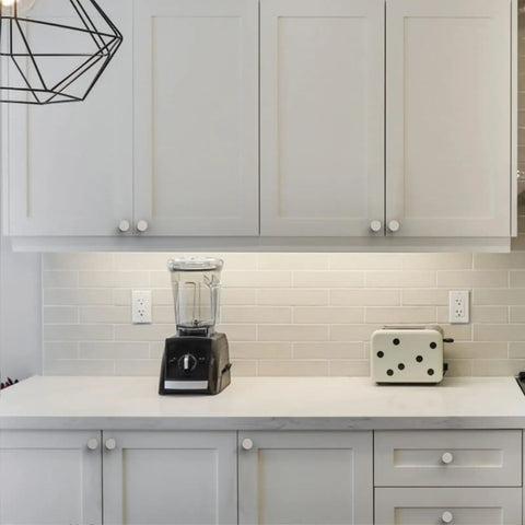 Top Shelf Brushed Satin Nickel Kitchen Cabinet Knobs 6 Pack used on white kitchen cabinets with a blender and toaster.