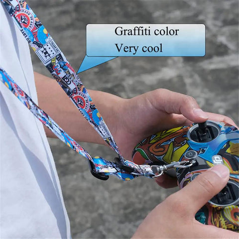Person holding remote with Adjustable Drone Controller Neck Strap With Wide Compatibility For Avata 2 Avata FPV Remote Controller 3 2 Phantom 3 4 Pro Sling Lanyard For Keys ID Cards Game Console Anti Drop Comfort Graffiti Look in graffiti color