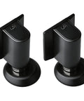 Sleek 2 Piece No Drill Door Stopper Set Made From Durable Steel With Invisible Design For Home Or Office Plus Strong 3M Adhesive Backer For Easy Install Without Damaging Walls Or Holes In Room Entryway, showing two black steel door stoppers.