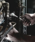 Mechanic using Zyklop Metal Ratchet With Switch Lever, Three Eighths Inch Drive, Ultra Slim Long Handle in machinery maintenance