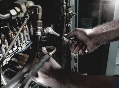 Mechanic using Zyklop Metal Ratchet With Switch Lever, Three Eighths Inch Drive, Ultra Slim Long Handle in machinery maintenance