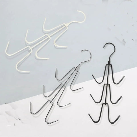 Image of 2 Pack Closet Purse Hangers, Game Changer Handbag Organizer Rack, featuring silver and black hooks, arranged for easy storage.