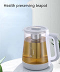 2 Liter Multifunctional Electric Kettle And Coffee Pot With Built In Strainer Stewing Cup Health Focused Water Boiler Top Tier Kitchen Essential Smooth Operator For Daily Brewing And No Stress Cooking on counter with tea inside.