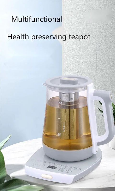 2 Liter Multifunctional Electric Kettle And Coffee Pot With Built In Strainer Stewing Cup Health Focused Water Boiler Top Tier Kitchen Essential Smooth Operator For Daily Brewing And No Stress Cooking on counter with tea inside.