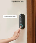 2K PoE Doorbell Camera With Chime V2 Outdoor IP Security Cam with a person's hand pressing the doorbell button on a wall mount.