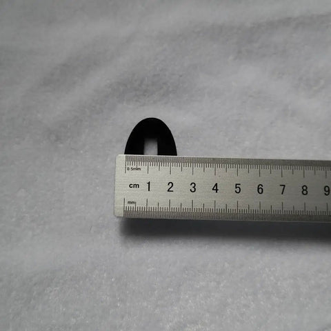 Close-up of Fuchi Kashira Iron Alloy Set For Samurai Tsuka Handle Ferrule Caps 01 To 07 with ruler for size reference.