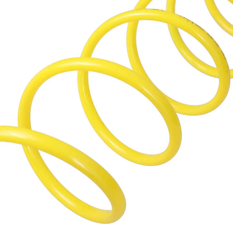 Close-up of yellow coiled nylon air hose, 12 feet, lightweight, anti-corrosion, abrasion-resistant, with brass 1/4 inch NPT fittings.