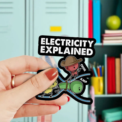 Hand holding Three Piece Electricity Explained Sticker Set With Funny Volts Amps Ohms Quotes For Electrical Engineers waterproof vinyl.