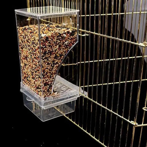 Dope Game Changer No Mess Bird Feeder For Cage With Auto Seed Guard, clear feeder with seeds attached to cage.