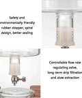 Detailed view of the Badass Cold Brew Drip Tower showing rubber stopper and flow rate valve for slow extraction.