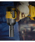 Super Powerful Cordless Impact Wrench With Brushless Motor And Heavy Duty High Torque Design Perfect For Auto Repair Woodworking And Scaffold Projects Lightweight Ergonomic Grip Allows Seamless Use Anywhere held in gloved hand with socket attachment.