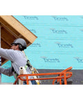 Worker applying Zero Hassle Heavy Duty Synthetic Roof Underlayment Covers A Whole 10 Squares Of Your Deck Pro Level Waterproof Protector.