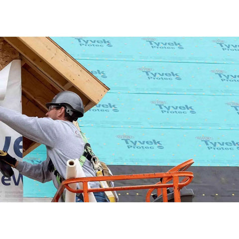 Worker applying Zero Hassle Heavy Duty Synthetic Roof Underlayment Covers A Whole 10 Squares Of Your Deck Pro Level Waterproof Protector.