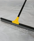 Built Tough 24 Inch Floor Squeegee With 60 Inch Extendable Handle for Concrete and Tile Floors in action on wet surface