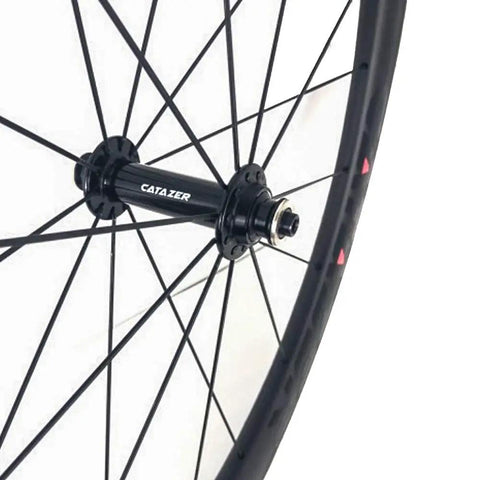 Close-up of Carbon Road Bicycle Wheelset Clincher 50mm Deep Rim Basalt Brake Surface 3K Weave With Novatec ABG Hub