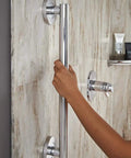 Person using 18 Inch Matte Black Shower Grab Bar ADA Compliant 450 Lb Capacity Wall Mounted Safety Handle For Shower And Bathtub Handicap Grip