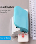 6 Hole Punch Handheld Metal Craft Tool For Binding Notebooks And Scrapbooks, resting next to spiral notebook, easy portable design