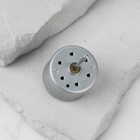 Top view of 5.9V RF-310T-11400 Mini DC Motor, 22mm shaft, 24mm diameter, ideal for small fans, DIY electronics, and toys