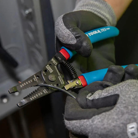 Gloved hands using Built Tough Heavy Duty Wire Cutter And Stripper For 20 To 30 AWG Solid And 22 To 32 AWG Stranded Wire in action