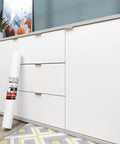 White Contact Paper Peel And Stick Wallpaper For Cabinets And Walls Self Adhesive Matte Vinyl Wrap in front of white cabinets.